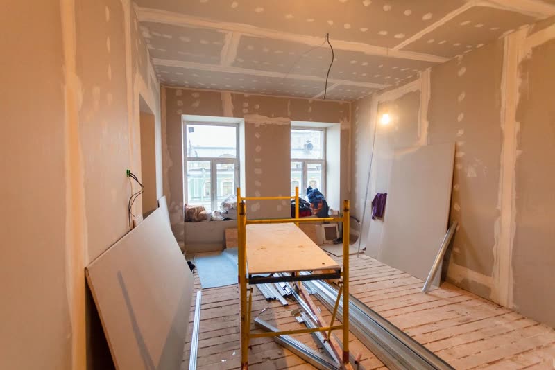 Room being finished with drywall and scaffolding