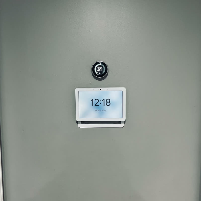 Smart home panel installed on a painted wall
